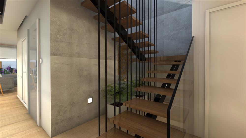 Escalier intérieur moderne avec limon central en métal, marches en bois massif et barreaux verticaux noirs, illustrant les tendances 2025 pour vos escaliers intérieurs.